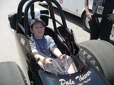 Jason tries out the seat of the Hemi Hunter fueler (another of my all time favorites). He's not sad to be there, just another pre-teen case of hiding his braces in every photo!