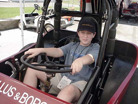 Jason tries out the seat of the Winged Express. What a man Willie must have been and what a man Mike Boyd is now. I swear you're more snug in a Jeep with the top down than you are in this thing!