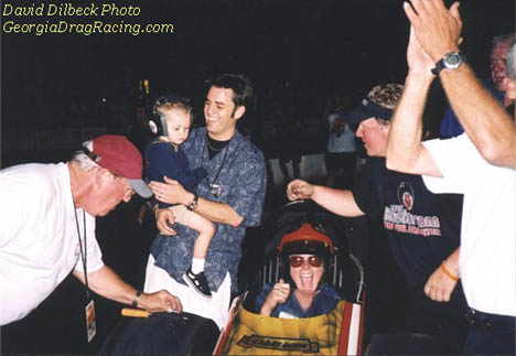 Three generations of Dixons celebrate Larry, Sr. driving at the 2003 NHRR Cacklefest. Photo by David Dilbeck