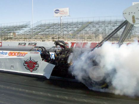 The Cowin kid smoke's 'em in the Carrier Boyz car. Car is NHRA only -- a surprise.
