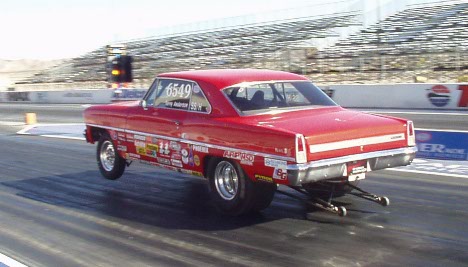 Red Chevy II launches hard.