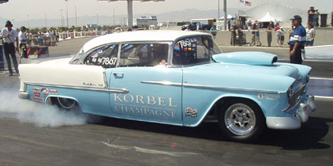Dean Hall drives the gorgeous Korbel Champagne 55 Chevy Bel Air that has an all aluminum 565ci Donovan Chevy under its baby blue hood.