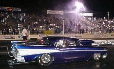 Robert Tyree's show quality '57 Chevy was in the show after the first session. 7-08-00 by Tim Pratt
