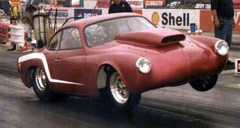 Vince Heuer puts the wheels up and marches in his 9 second Karman Ghia. Photo by Jerry Heuer