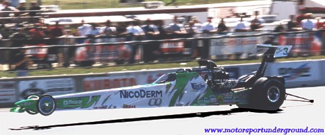Laurie Cannister puts the wheels in the air in her Pro Outlaw dragster at Epping. Photo by James Morgan