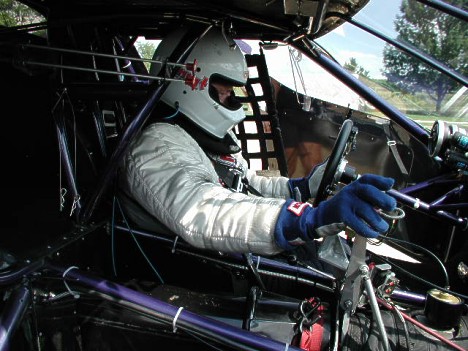 Bill Kuhlmann in a moment of concentration before he blasts to the quickest and fastest times in doorslammer history. Photo by John Lindsey