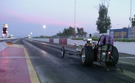 Laurie Watts racing at dusk, 2000. Photo by Earl Watts