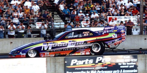 Paul Gill's screw blower equipped ModuLine funny car completely dominated the action over its Roots-blown competitors. James Morgan photo