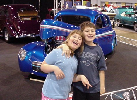 Emily and Jason ham it up in front of a nice '40 Ford. Photo by Tim Pratt