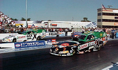 Is there anything more exciting than John Force....how about two John Force cars at once? John vs. Tony in qualifying. Photo by Tim Marshall